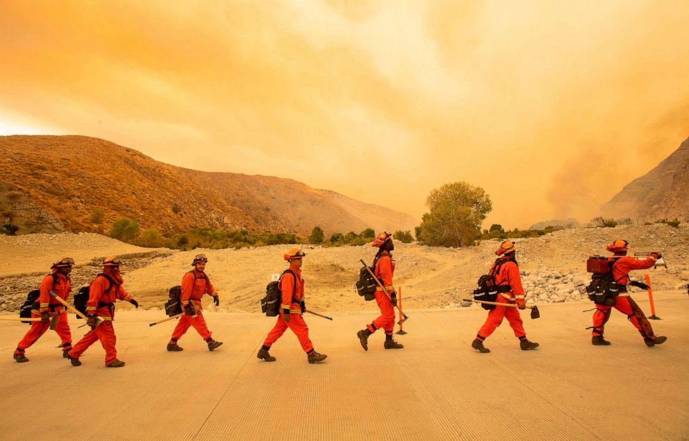 PHOTO: Inmate firefighters arrive at the scene of the Water fire, a new start about 20 miles from the Apple fire in Whitewater, Calif. on Aug. 2, 2020.