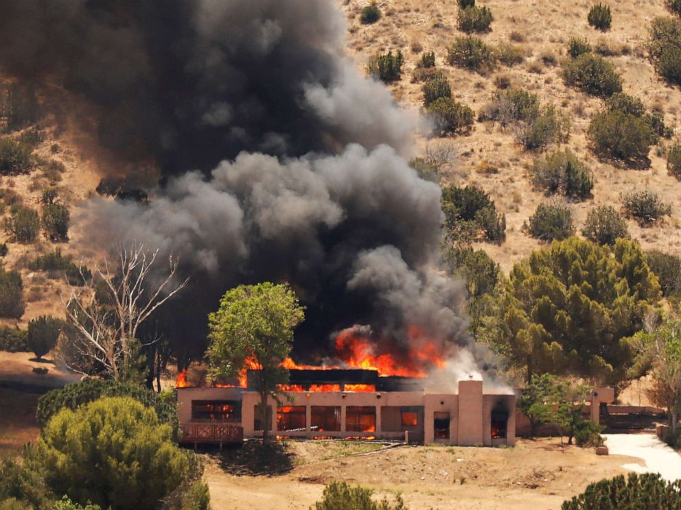 PHOTO: A burning home in Agua Dulce, Calif. believed to be the home of an off-duty firefighter who was involved in a shooting at the Agua Dulce fire station, June 1, 2021. 