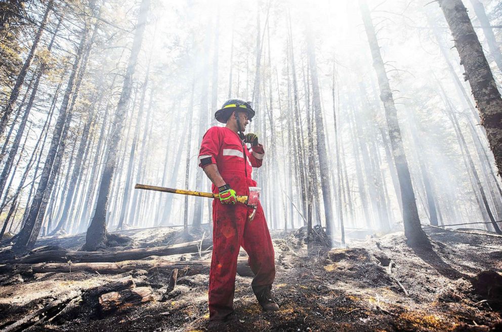 PHOTO: Halifax Regional Fire and Emergency firefighter Zach Rafuse works to put out fires in the Tantallon area of Halifax, Nova Scotia, May 30, 2023