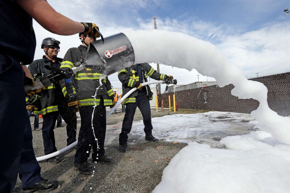 PHOTO: Seattle firefighters spray foam from two different types of valves during a specialized training session on how to respond to incidents involving oil trains, Oct. 8, 2014, in Seattle.
