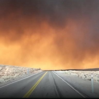 A driver had an ominous view of smoke rising from a wildfire burning in California and Nevada, that has left at least one person dead.