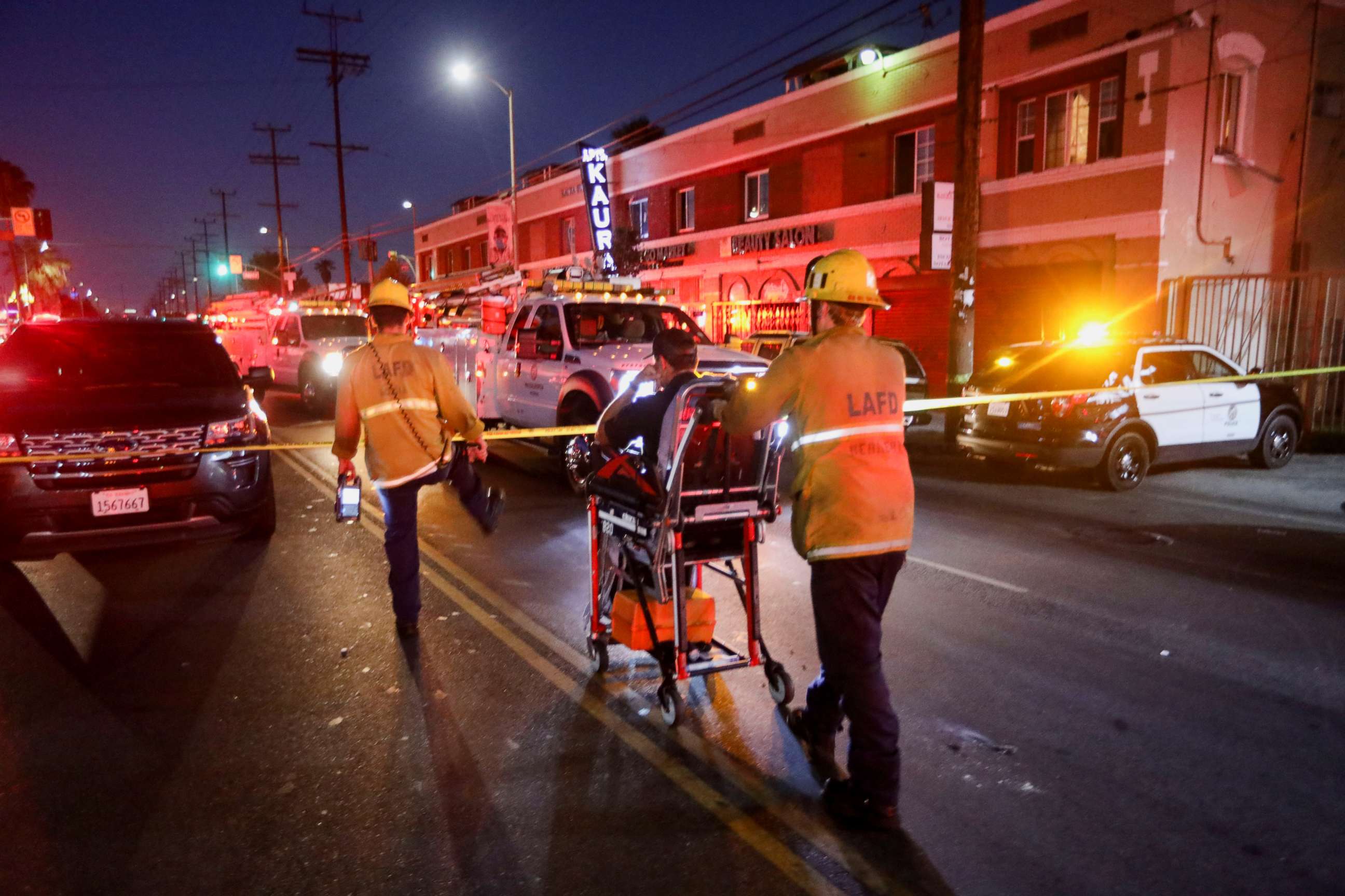 PHOTO: Members of the Los Angeles Fire Department transport a person at the site of an explosion after police attempted to safely detonate illegal fireworks that were seized, in Los Angeles, California, U.S., June 30, 2021. REUTERS/David Swanson
