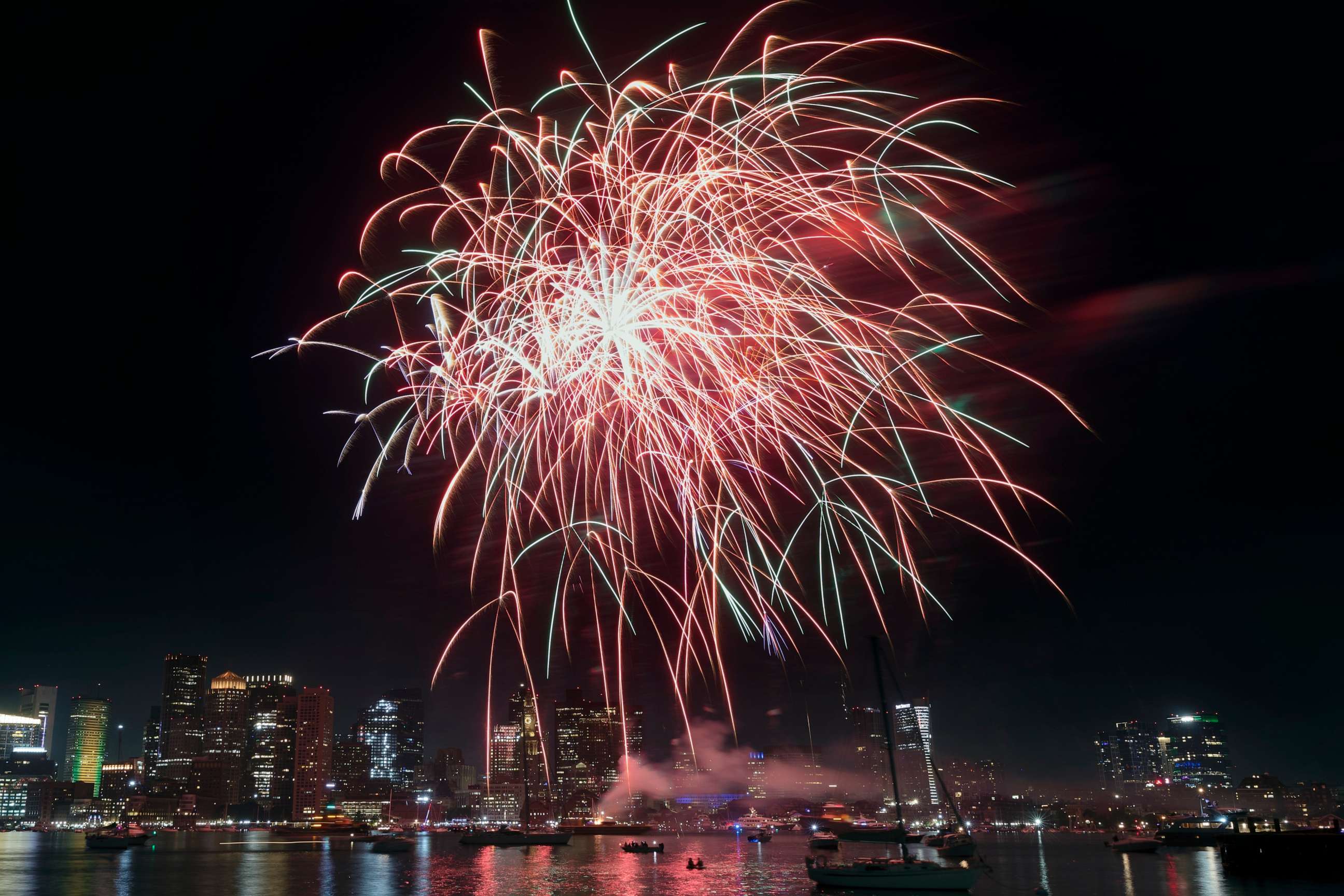 PHOTO: Fireworks explode over the harbor during Boston Harborfest's Fourth of July weekend celebrations, Saturday, July 1, 2023, in Boston.