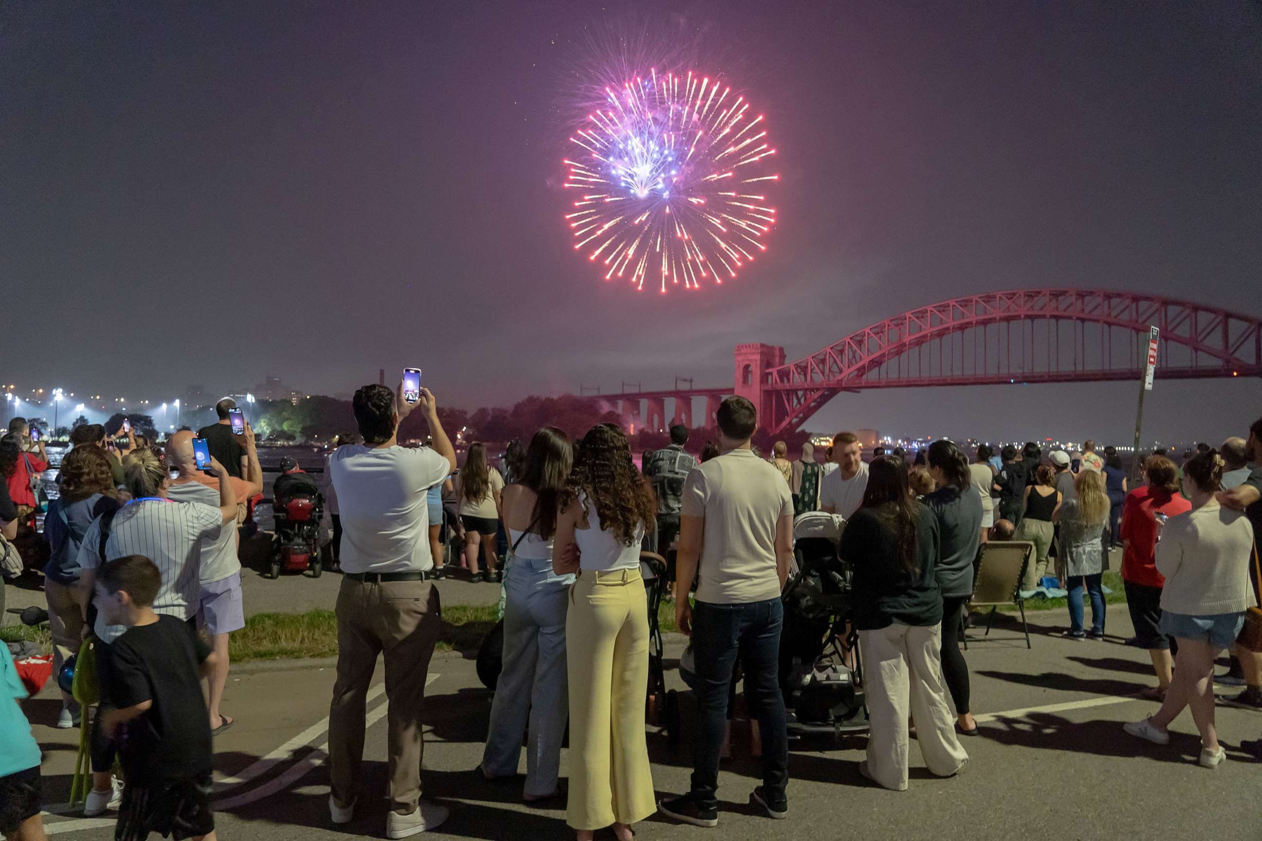 PHOTO: Spectators watch fireworks explode during the Central Astoria annual Independence Day Celebrations fireworks display in Astoria Park on June 29, 2023, in New York.