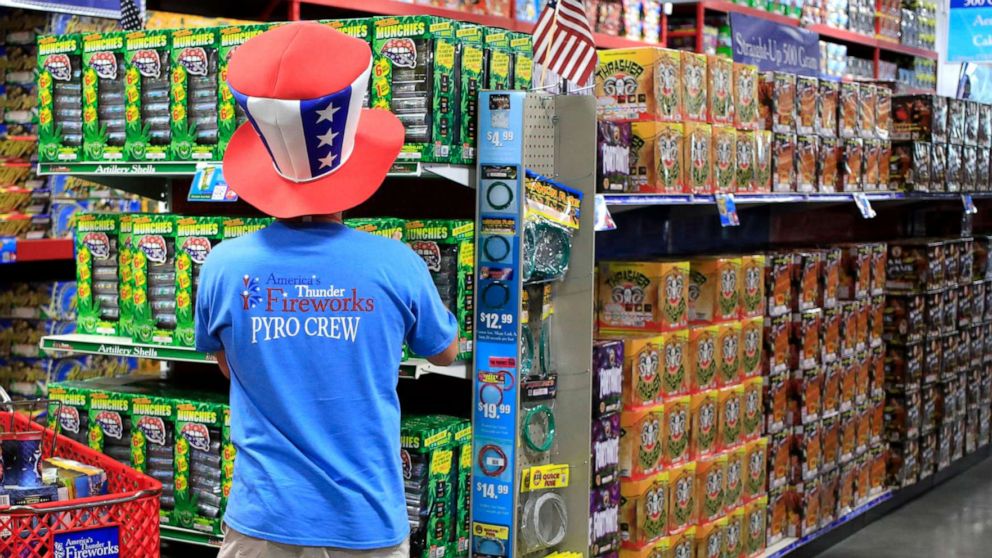 PHOTO: A worker arranges merchandise at America's Thunder Fireworks store in Shepherdsville, Ky., June 29, 2021.