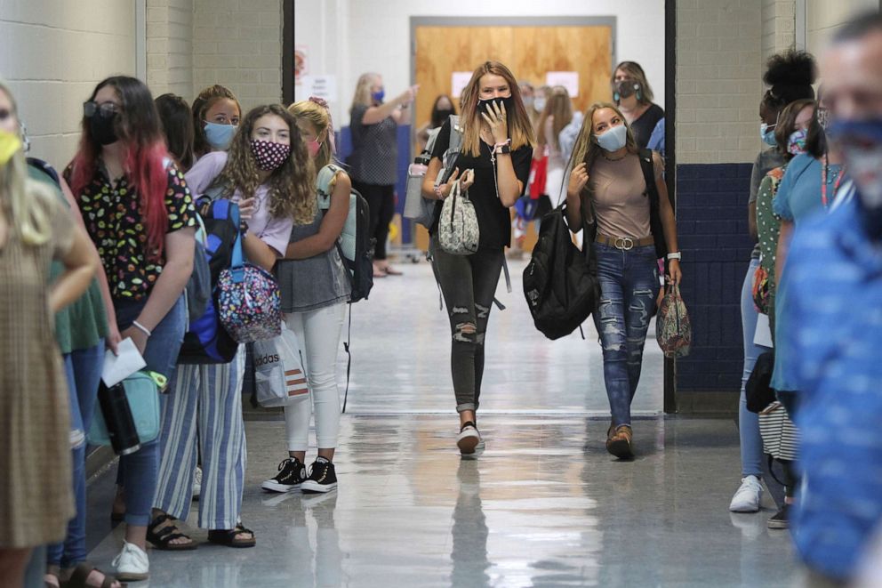 PHOTO: Guntown Middle School eighth grade girls walk the halls first to their next class before the boys are dismissed during a class change on the first day back to school for the Lee County District, in Guntown, Mississippi, on Aug. 6, 2020.