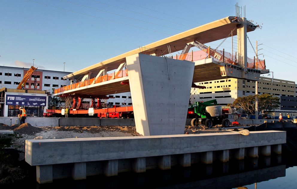 PHOTO: The main span of the a pedestrian bridge that is being positioned to connect the City of Sweetwater, Fla., to Florida International University near Miami is seen, March 10, 2018.