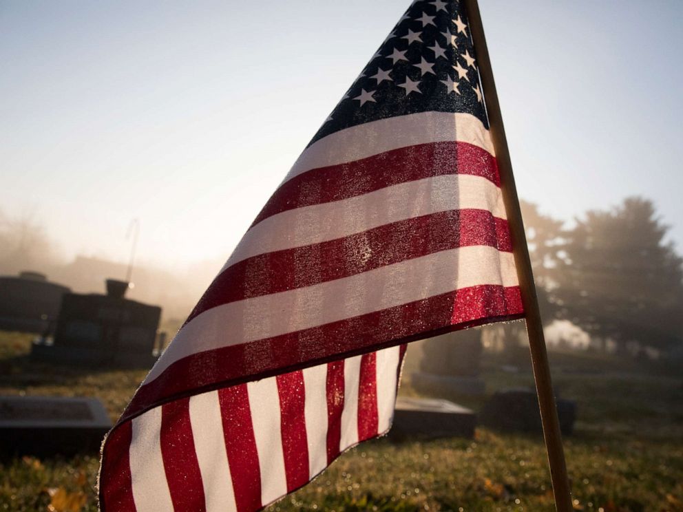 PHOTO: An American flag flies at a grave in this stock photo.