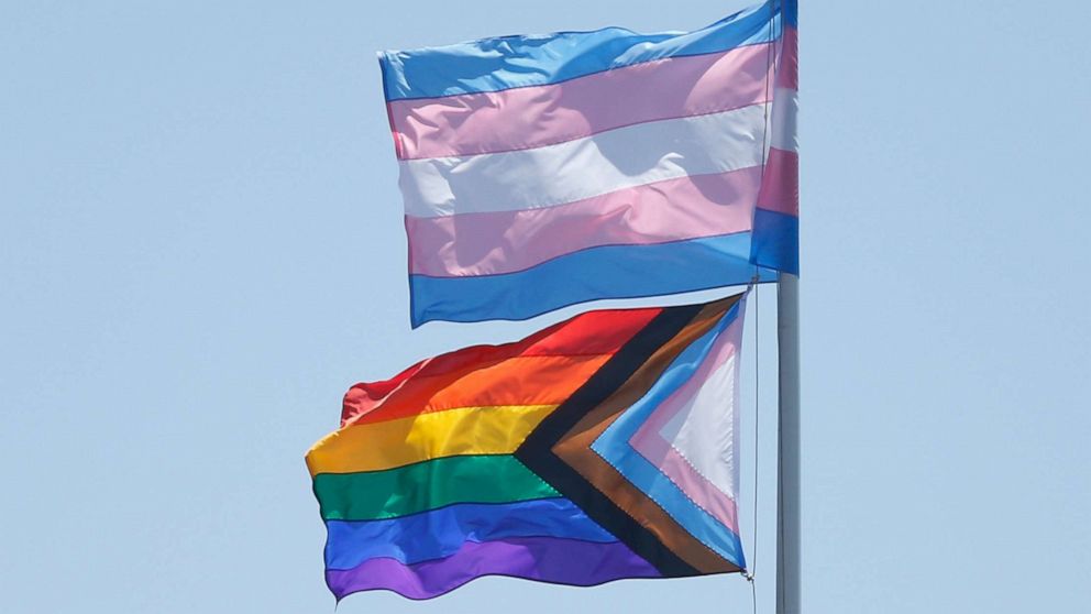 PHOTO: The transgender flag and progress pride flag fly at Oracle Park during the game between the San Francisco Giants and the Chicago Cubs at Oracle Park, June 6, 2021, in San Francisco.
