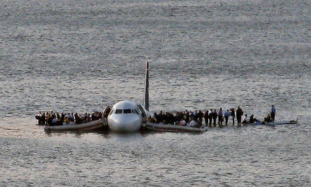 PHOTO:  In this Thursday Jan. 15, 2009 file photo, airline passengers wait to be rescued on the wings of a US Airways Airbus 320 jetliner that safely ditched in the frigid waters of the Hudson River in New York.