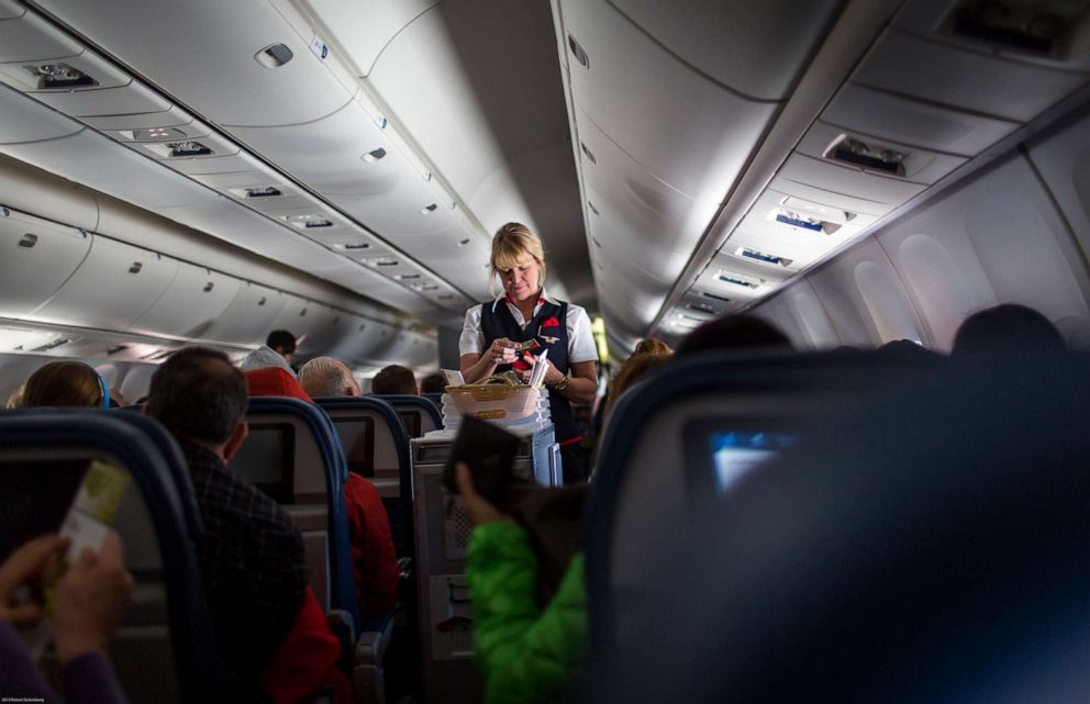 PHOTO: A Delta Airlines stewardess sells food on board a San Francisco bound plane outside of New York, April 11, 2014.