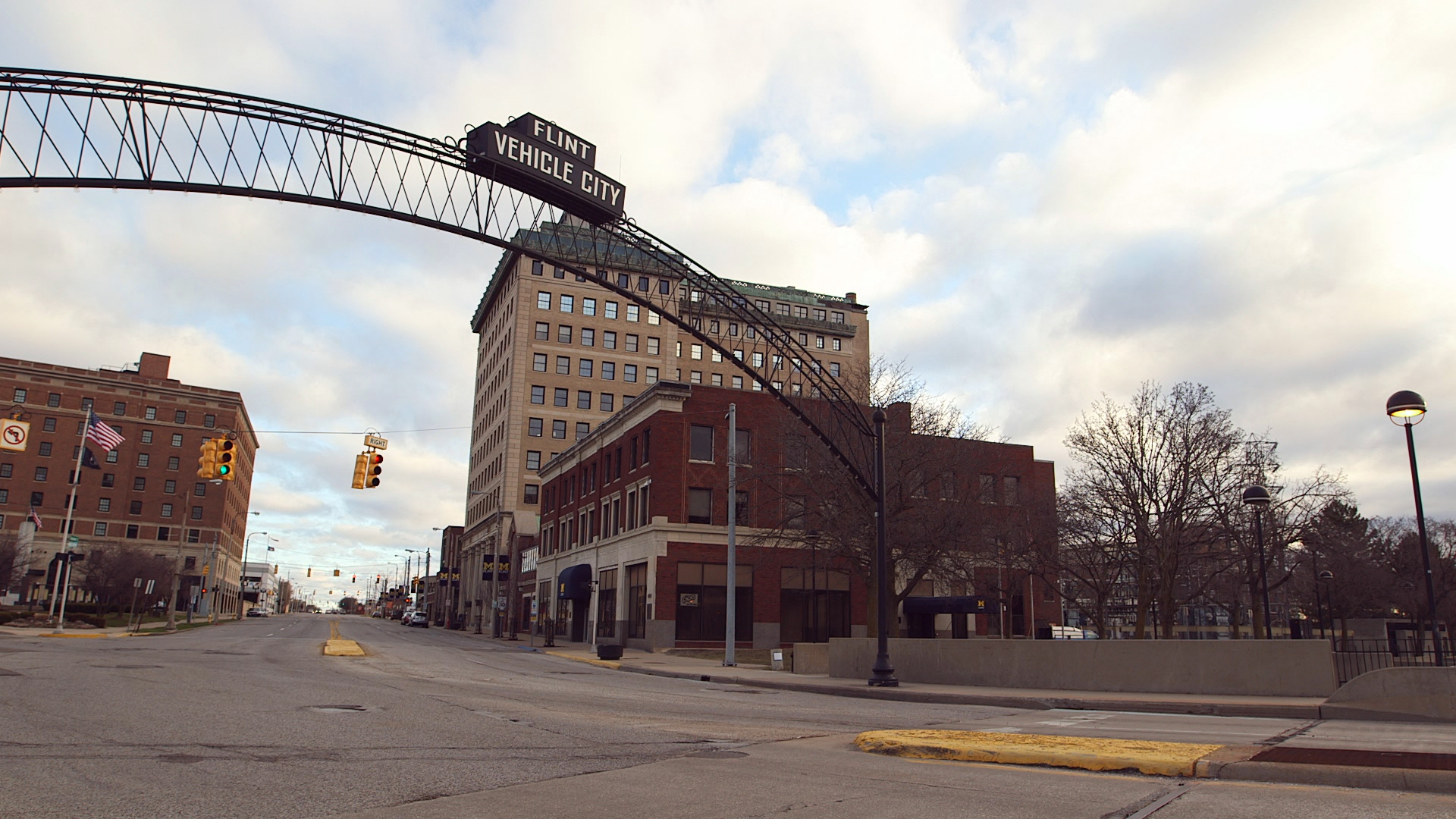 PHOTO: A Flint "Vehicle City" sign stands on Saginaw Street in downtown Flint, Mich. 