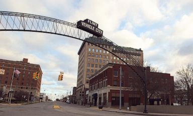 PHOTO: A Flint Vehicle City sign stands on Saginaw Street in downtown Flint, Mich.