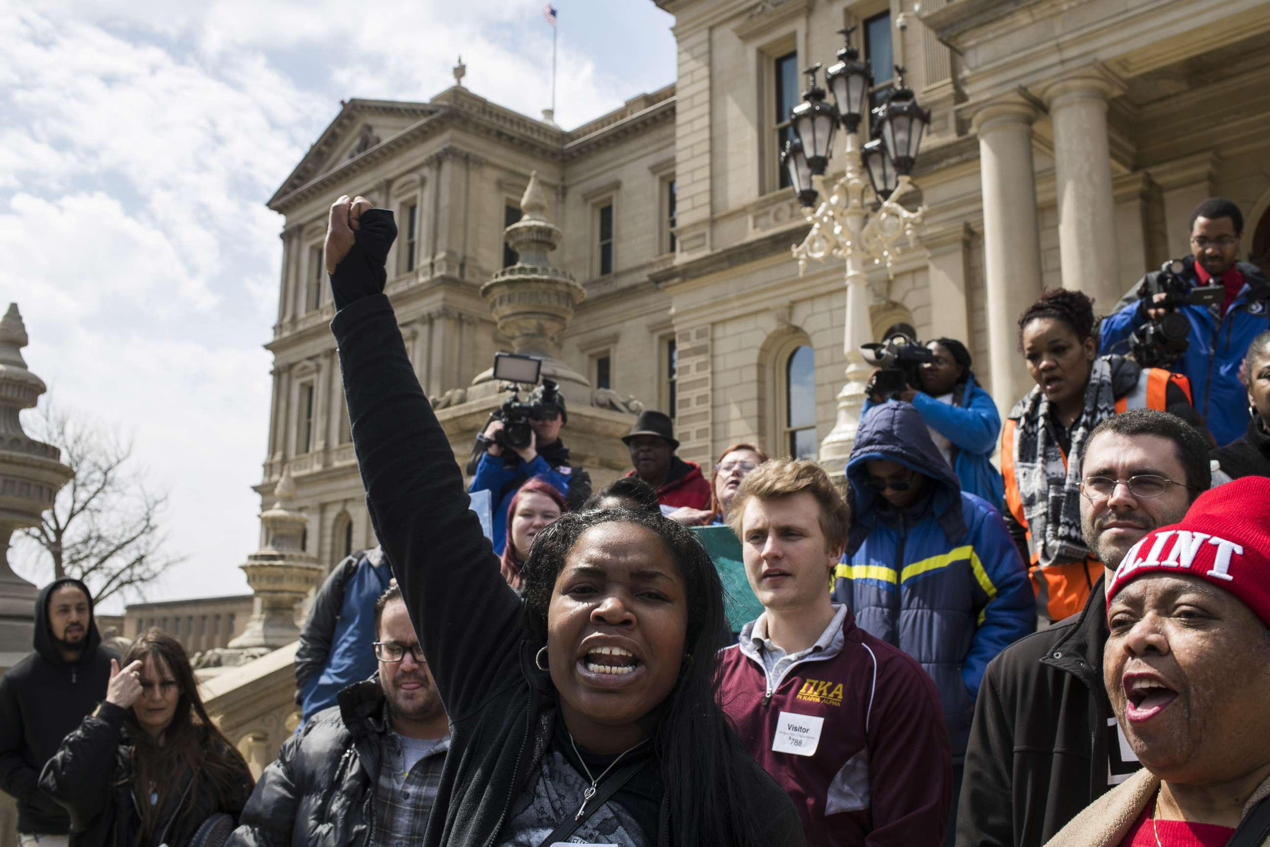 PHOTO: Ariana Hawk of Flint, Michigan, leads a chant during a protest on the steps of the Michigan State Capitol on April 11, 2018 in Lansing, Michigan.