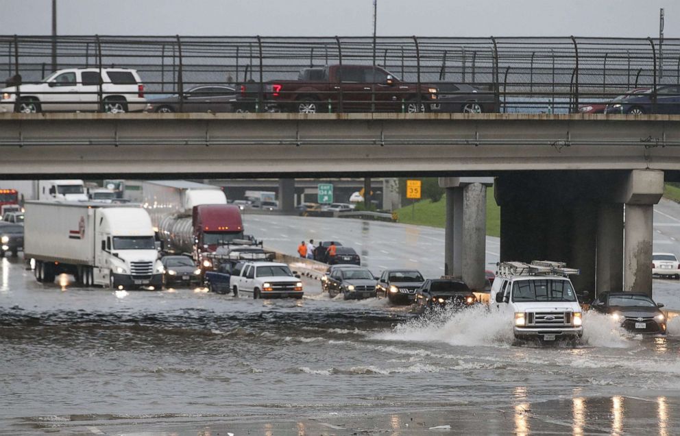 PHOTO: Cars pull to the side of the freeway of highway 69 North to get by the flood waters on September 19, 2019 in Houston, Texas.