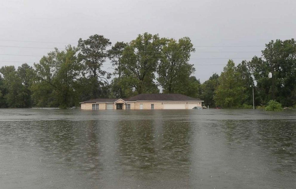 PHOTO: Remnants of Tropical Depression Imelda flood a home on Thursday, Sept. 19, 2019, near Devers, Texas.