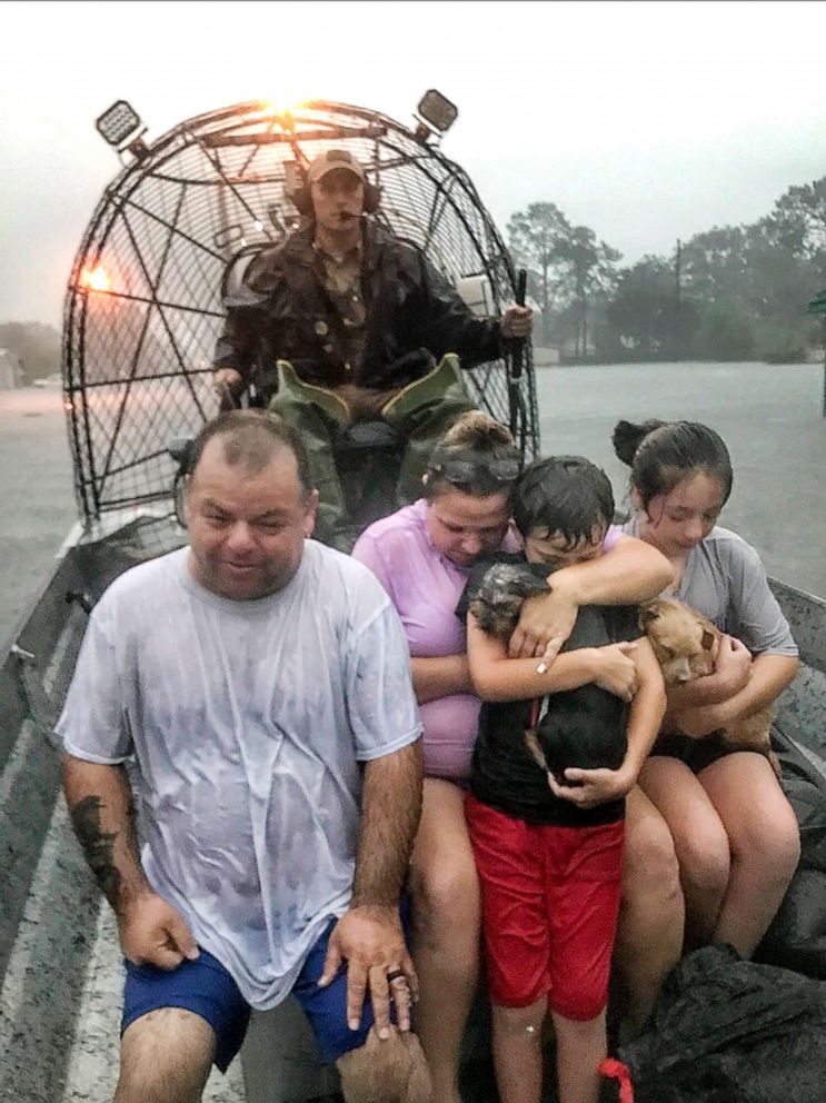 PHOTO: In this photo provided by the Texas Parks & Wildlife Department, a family is rescued via fan boat by a member of the department from the flood waters of Tropical Depression Imelda near Beaumont, Texas, Thursday, Sept. 19, 2019.