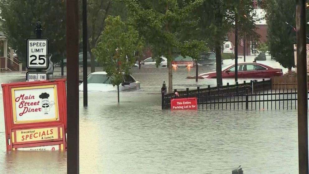 PHOTO: Cars sit in floodwaters in St. Louis, Mo., July 26, 2022, after heavy rains caused flash flooding.