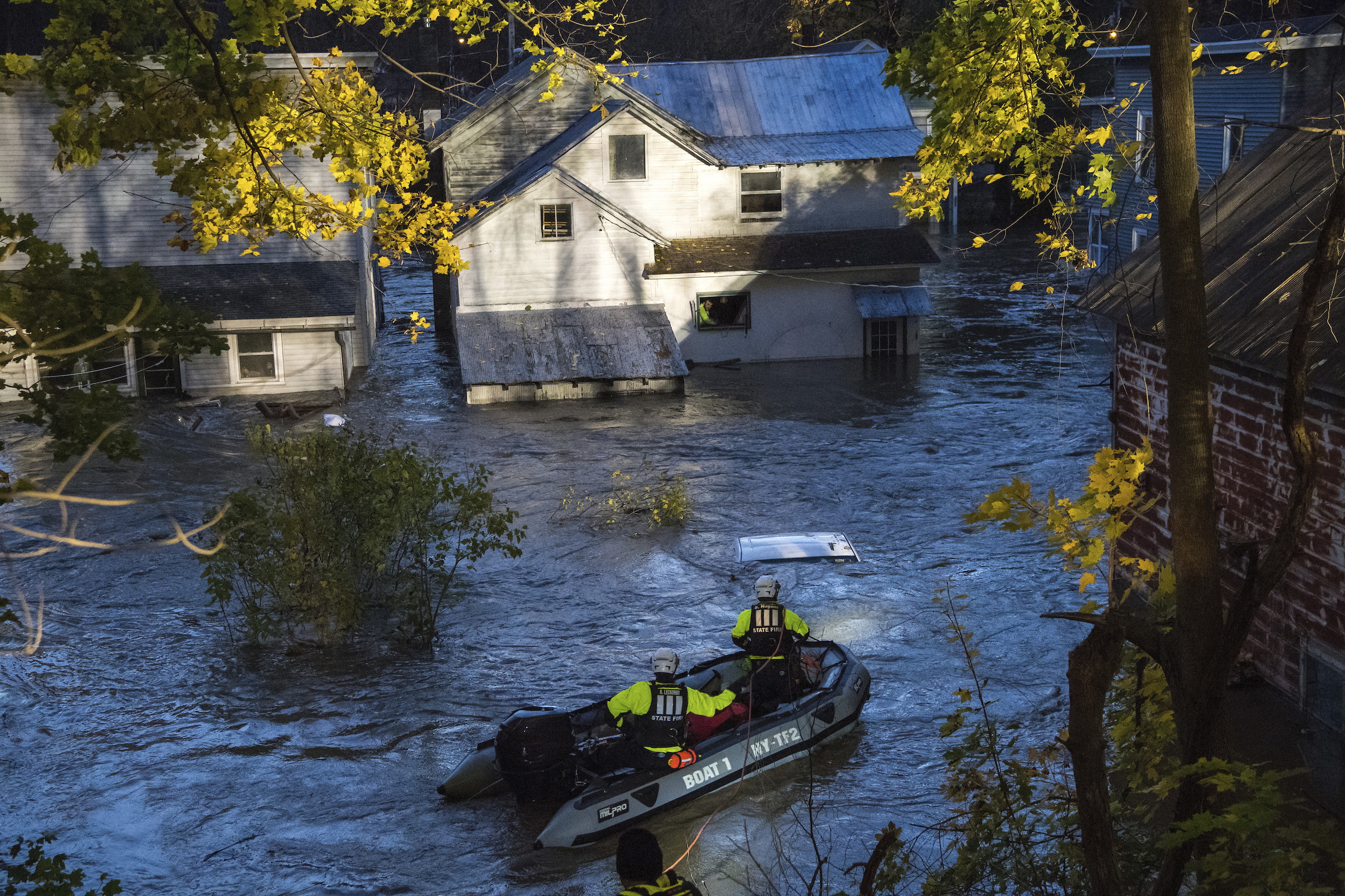 PHOTO: In this photo provided by the New York State Governor's Office, a man looks from a window of a house being flooded by rising waters of the East Canada Creek as police arrive in a rescue boat, Friday, Nov. 1, 2019 in Dolgeville, N.Y.