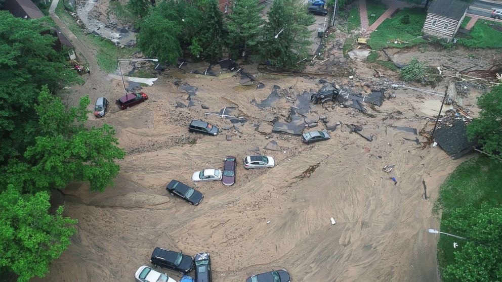 PHOTO: This image made from video provided by DroneBase shows vehicles swept by floodwater near the intersection of Ellicott Mills Drive and Main Street in Ellicott City, Md., May 28, 2018.