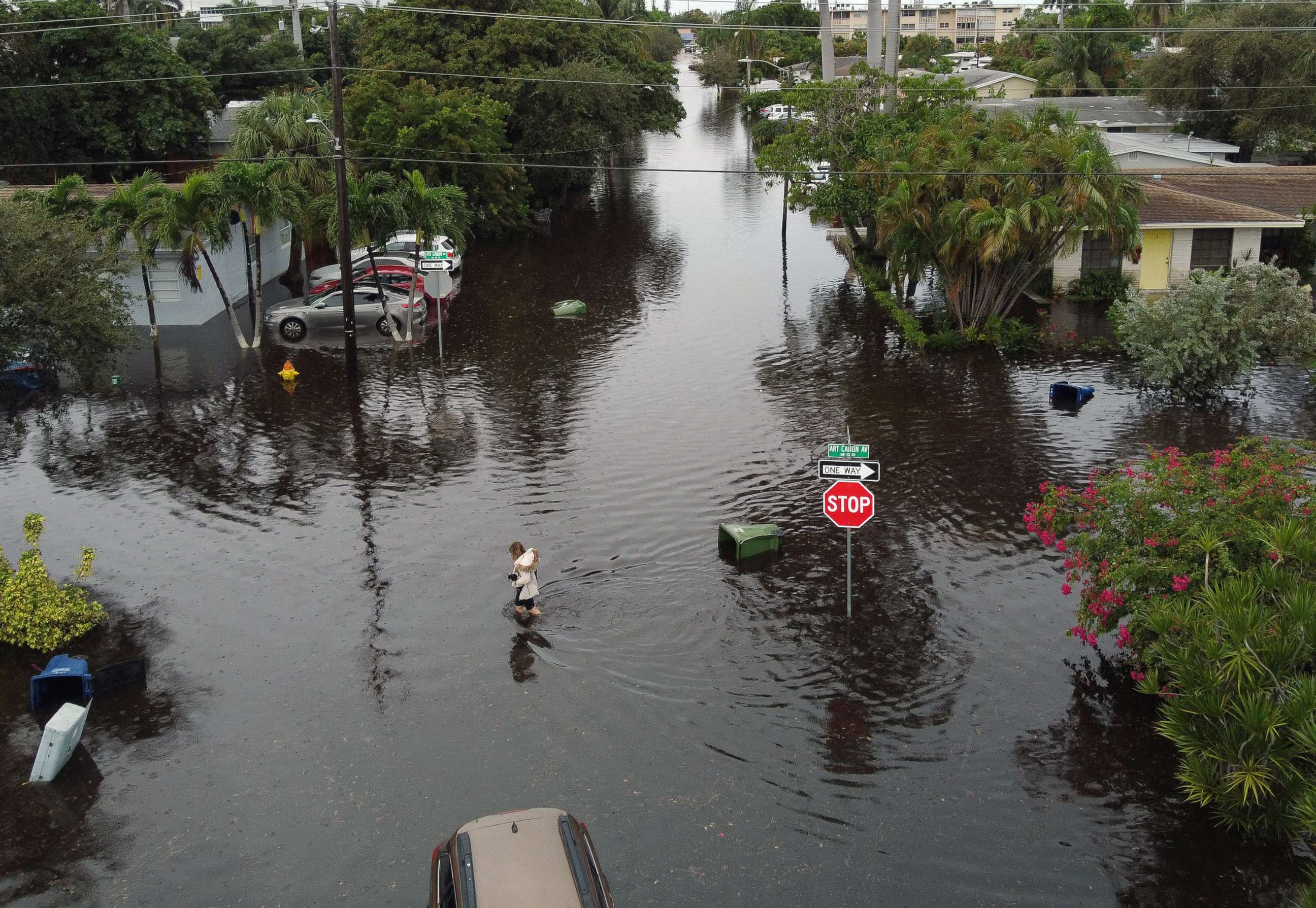 PHOTO: An aerial view from a drone shows a woman crossing a street inundated with flood water, Dec. 23, 2019, in Hallandale, Fla. 