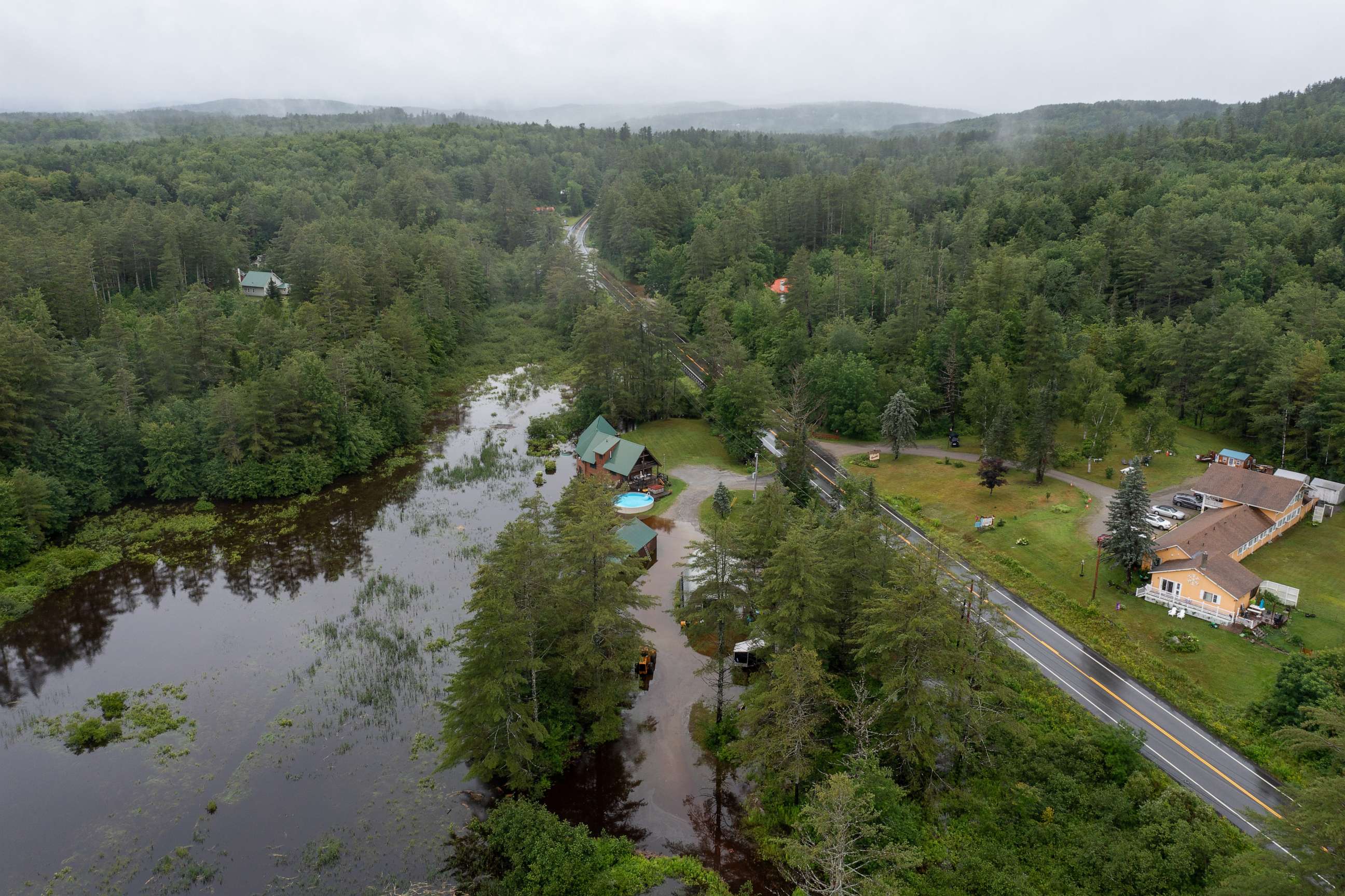 PHOTO: An aerial view shows floodwater covering residential property on Route 11 after heavy rainfall in Londonderry, Vermont, on July 10, 2023.