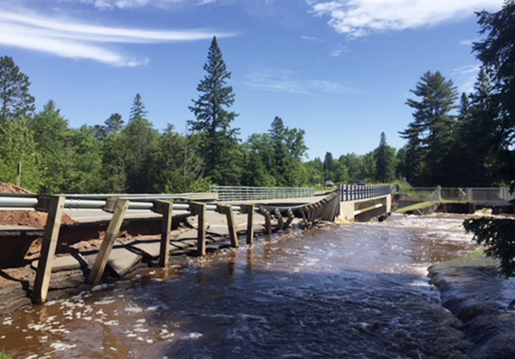 PHOTO: This photo provided by the Wisconsin Department of Transportation shows Wisconsin Highway 35 over Black River damaged from flash flooding in Pattison State Park in Douglas County, Wis., June 18, 2018.