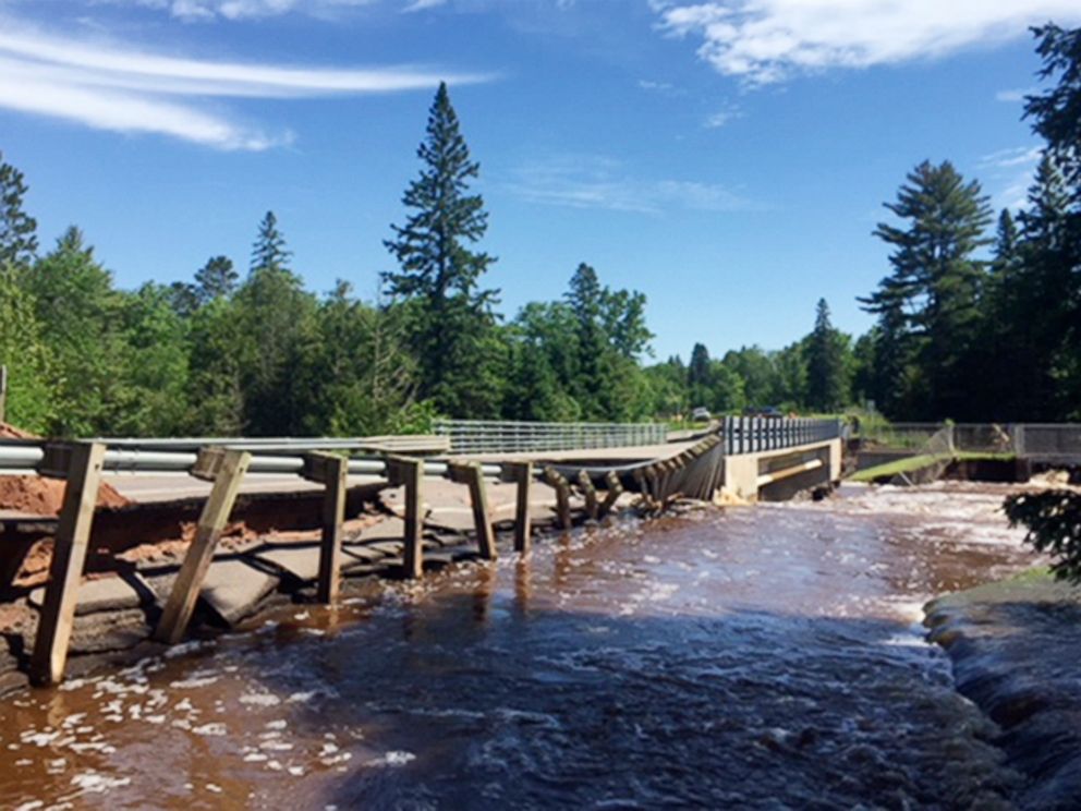 PHOTO: This photo provided by the Wisconsin Department of Transportation shows Wisconsin Highway 35 over Black River damaged from flash flooding in Pattison State Park in Douglas County, Wis., June 18, 2018.