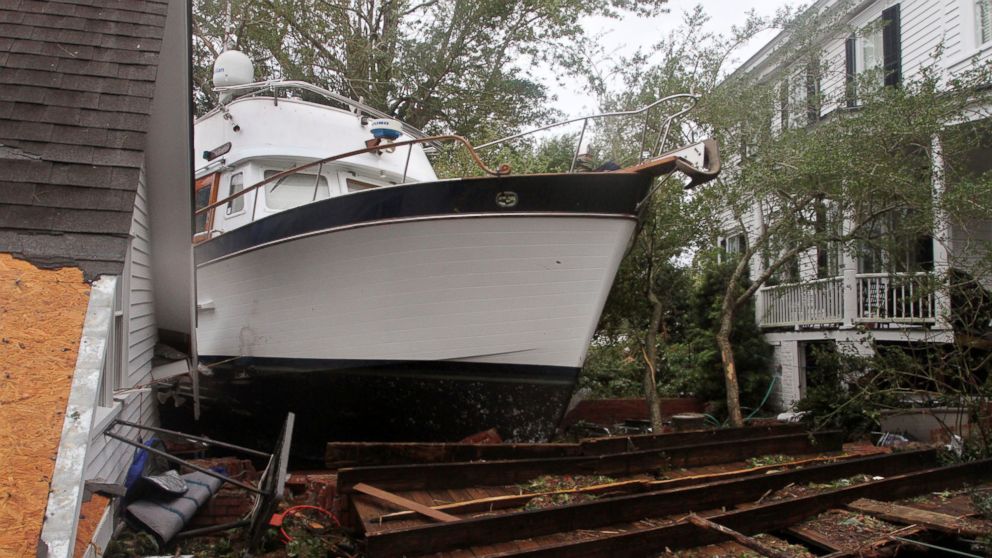 PHOTO: A 40-foot yacht lies in the yard of a storm-damaged home on East Front Street in New Bern, N.C., Saturday, Sept. 15, 2018. The boat washed up with storm surge and debris from Hurricane Florence.