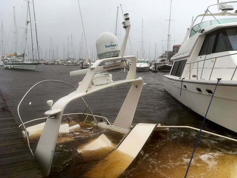 PHOTO: The mast of a sunken boat sits at a dock at the Grand View Marina in New Bern, N.C., on Friday, Sept. 14, 2018. Winds and rains from Hurricane Florence caused the Neuse River to swell, swamping the coastal city.