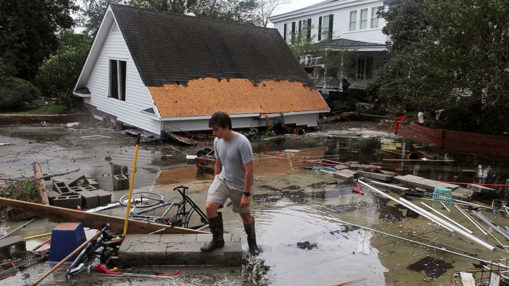 PHOTO: Resident Joseph Eudi looks at flood debris and storm damage from Hurricane Florence at a home on East Front Street in New Bern, N.C., Saturday, Sept. 15, 2018.