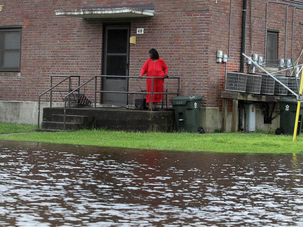 PHOTO: Residents at Trent Court Apartments wait out the weather as rising water gets closer to their doors in New Bern, N.C., Sept. 13, 2018.