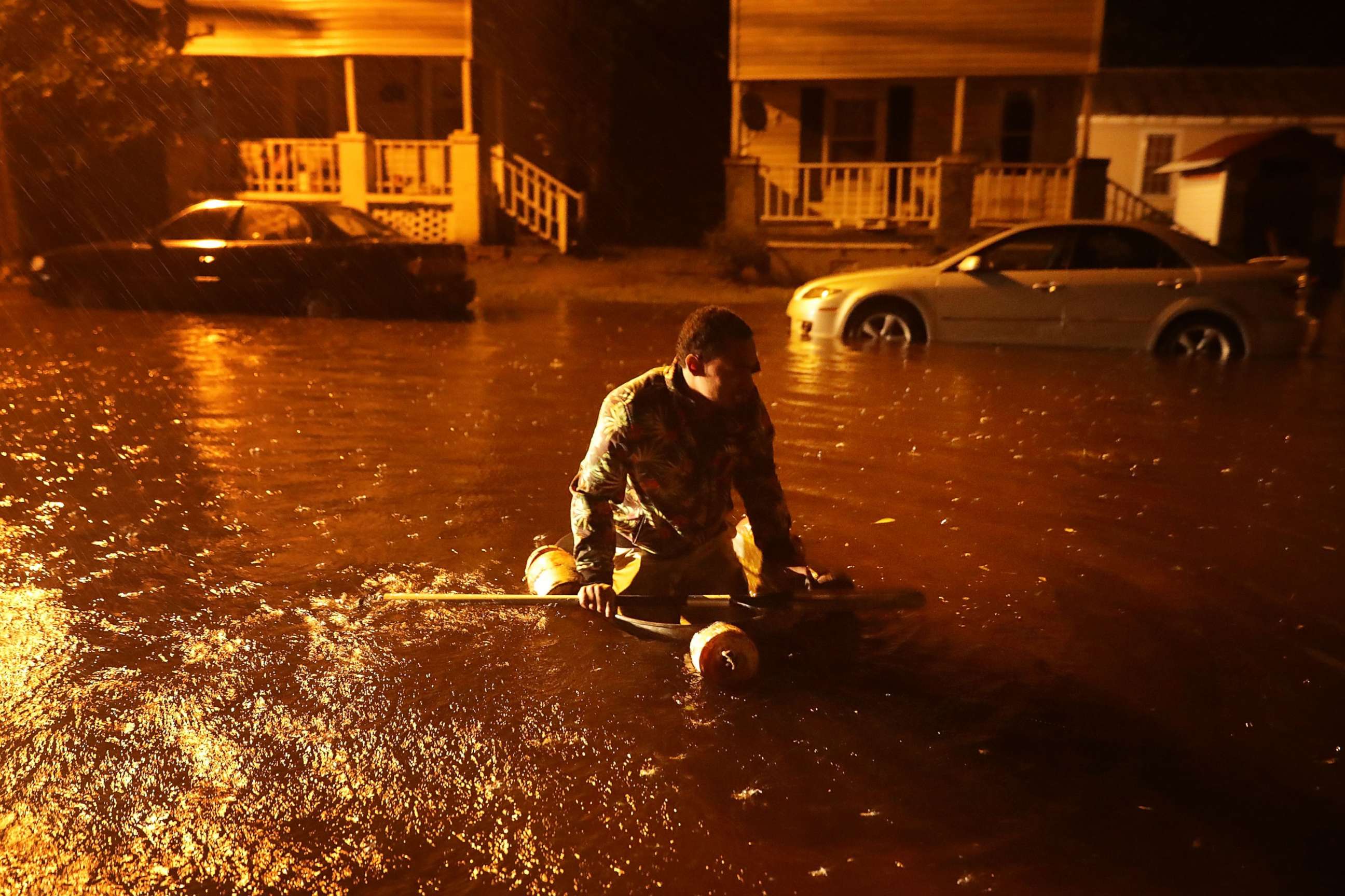 PHOTO: Michael Nelson floats in a boat made from a metal tub and fishing floats after the Neuse River went over its banks and flooded his street during Hurricane Florence Sept. 13, 2018 in New Bern, N.C.