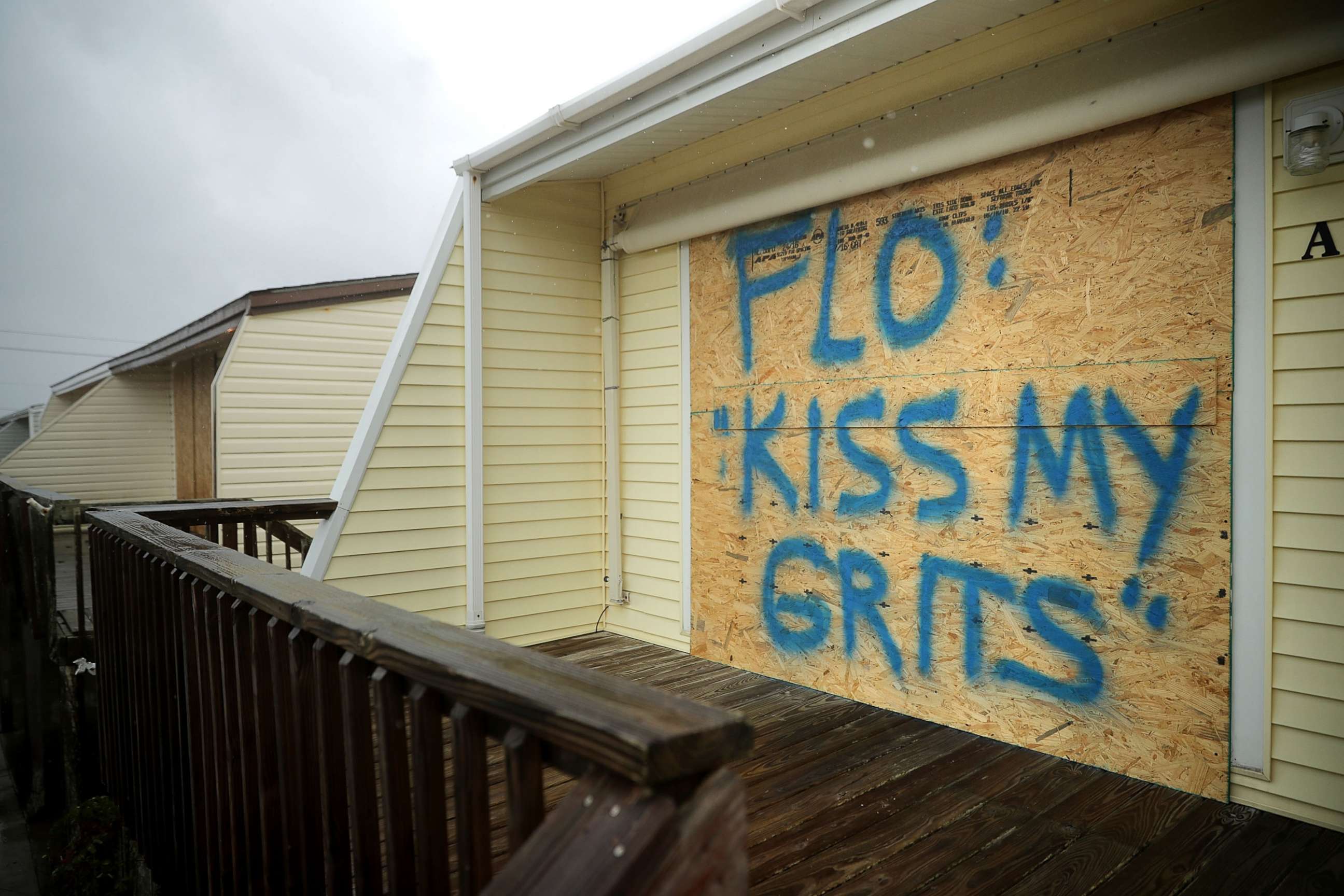 PHOTO: A spray painted message is left on a boarded up condominium, Sept. 13, 2018, in Atlantic Beach, N.C.