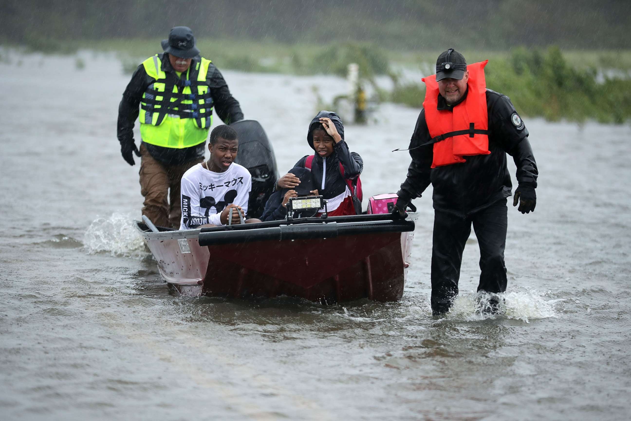 PHOTO: Volunteers from the Civilian Crisis Response Team help rescue three children from their flooded home, Sept. 14, 2018, in James City, N.C.