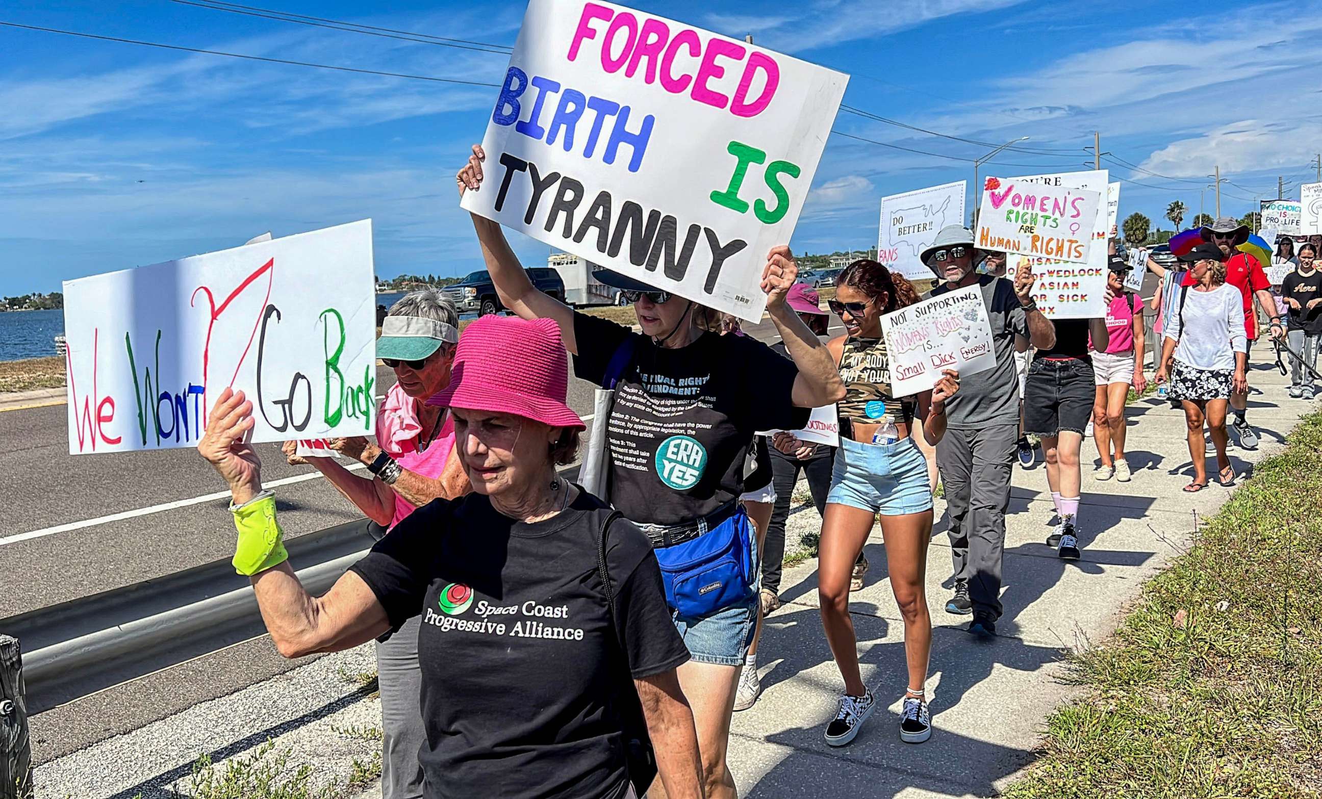 PHOTO: Supporters of abortion rights march along the Eau Gallie Causeway, April 8, 2023, during the "Shove Your 6-Week Ban" rally, in Brevard, Fla.