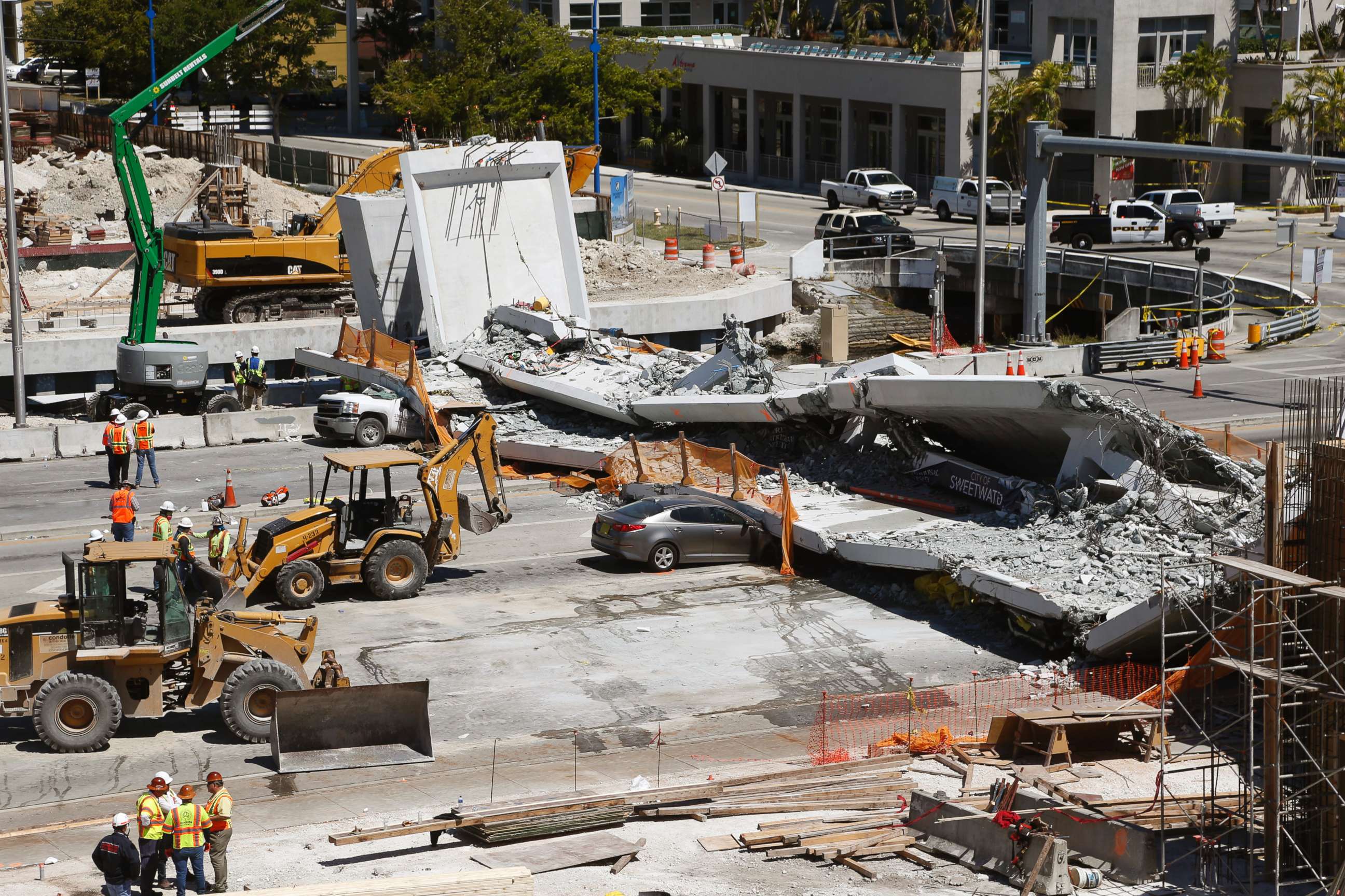 PHOTO: Crushed cars are shown under a section of a collapsed pedestrian bridge, March 16, 2018 near Florida International University in Miami.