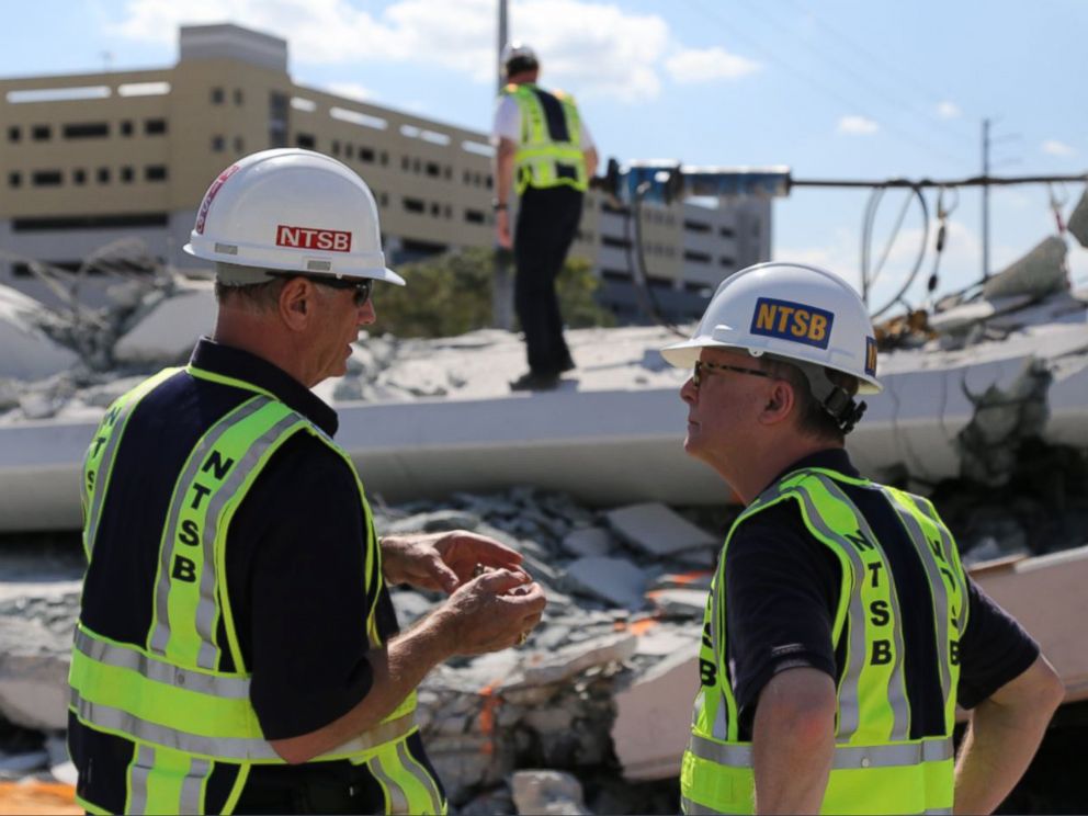 PHOTO: NTSB examine the debris from Thursdays collapse of a bridge on FIUs campus, March 16, 2018 in Miami.