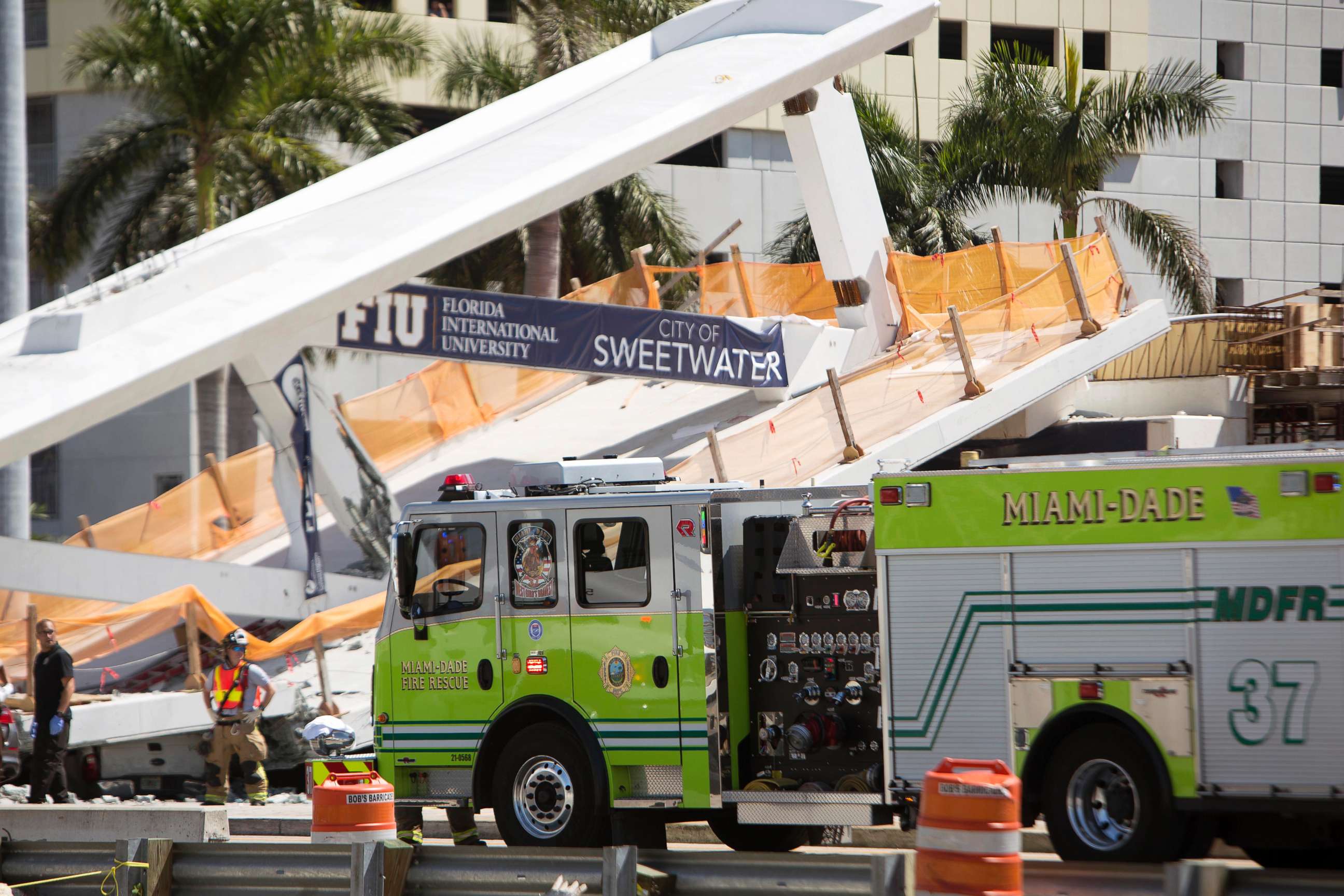 PHOTO: Emergency personnel responds to a collapsed pedestrian bridge connecting Florida International University on March 15, 2018 in the Miami area.