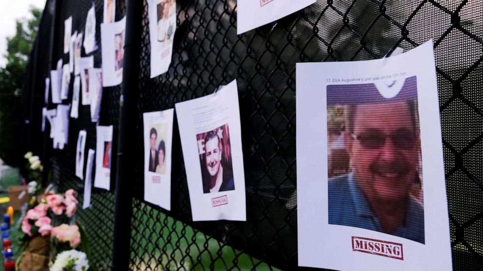 PHOTO: Pictures of missing people are seen hanging on a fence at a memorial on Harding Avenue as the rescue personnel continue their search for victims the day after a partial building collapse in Surfside near Miami Beach, Floa., June 25, 2021. 