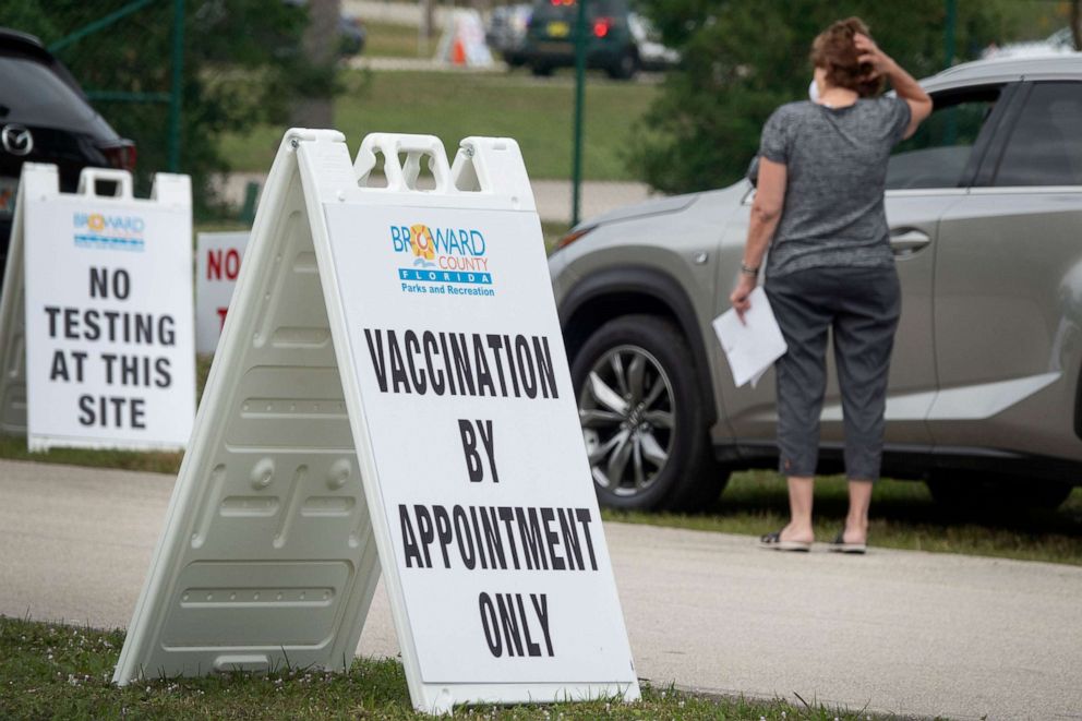 PHOTO: A woman waits to enter the locations where the Pfizer-BioNTech COVID-19 Vaccine is being given at the Vista View Park in Davie, Fla., Jan. 2021.