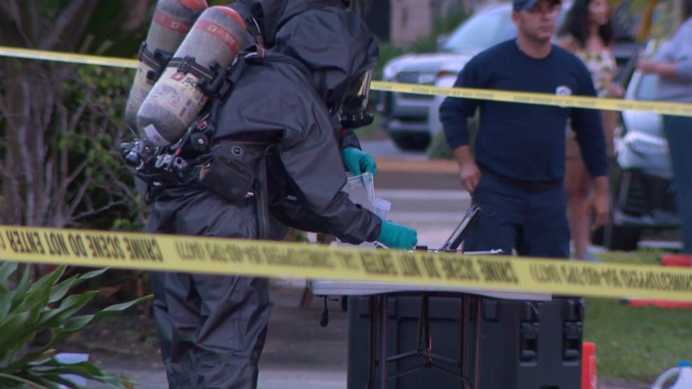 PHOTO: Authorities in hazmat suits test a substance found at a home where seven people overdosed on cocaine laced with fentanyl in Wilton Manors, Fla., on Thursday, March 10, 2022.