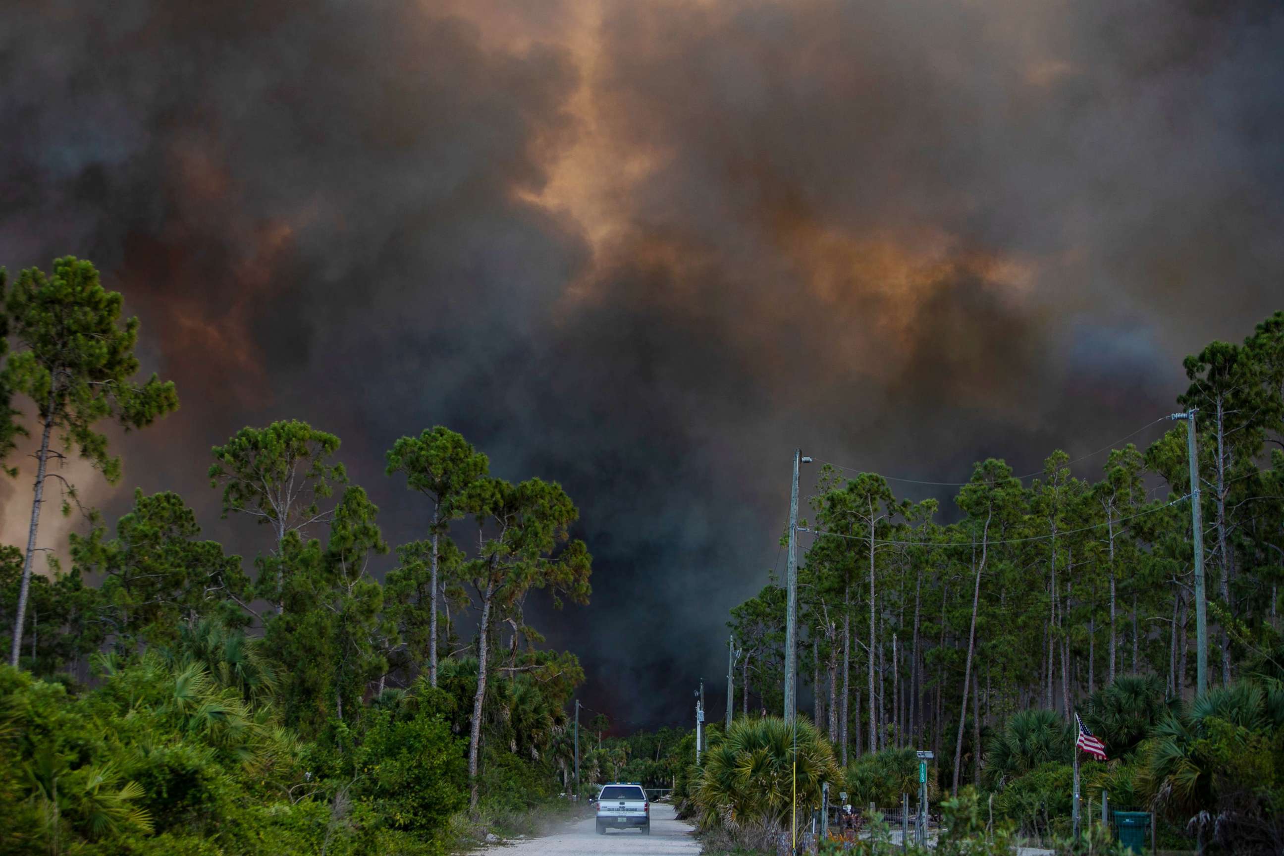PHOTO: Smoke from a brush fire in Golden Gate Estates is seen from Dove Tree Lane on May 13, 2020 in Florida.