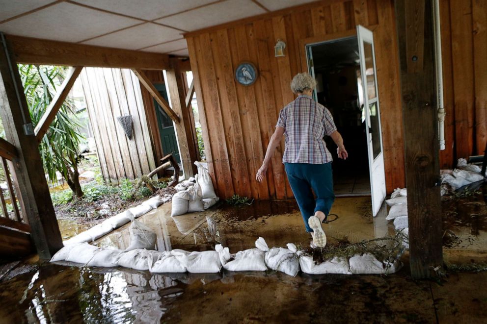 PHOTO: In this Sept. 2, 2016, file photo, Barbara Carroll surveys damage in and around her home from storm surge associated with Hurricane Hermine which made landfall overnight in the area in St. Marks, Fla.