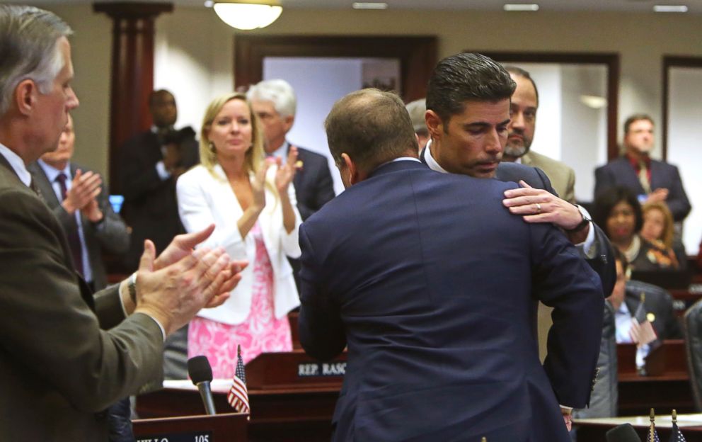 PHOTO: Rep. Jose Oliva, R- Miami Lakes, is hugged and congratulated by House members as the gun and school safety bill passed the Florida House 67-50 in Tallahassee, Fla.,March 7, 2018.