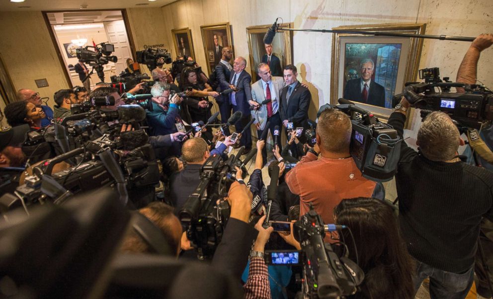 PHOTO:Andrew Pollack,and his son Hunter, center, speak to the media outside the governor's office after the governor signed the Marjory Stoneman Douglas Public Safety Act at the Florida State Capitol in Tallahassee, Fla.,March 9, 2018.