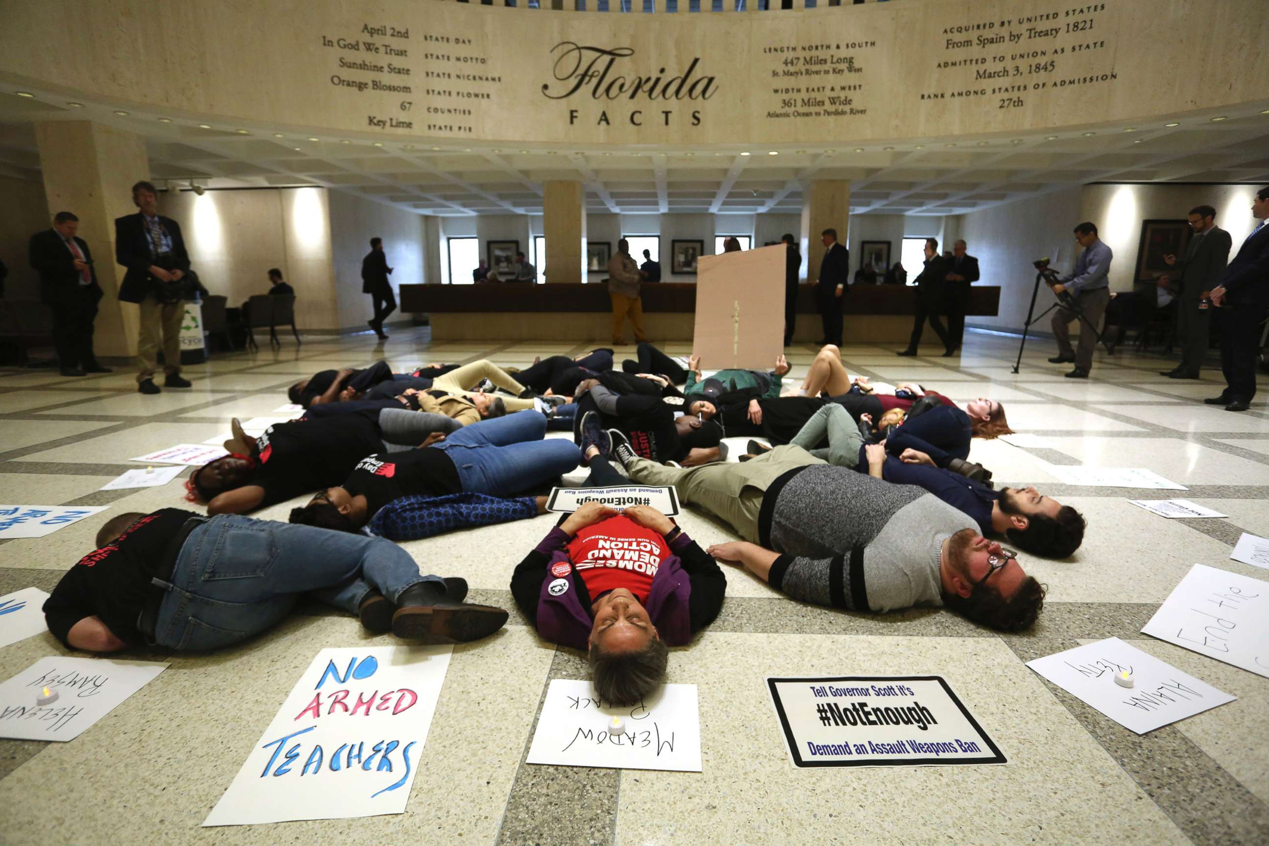 PHOTO: About 20 protesters participate in a die-In on the fourth floor rotunda of the Florida Capitol, in Tallahassee, March 6, 2018, as they continue to push for an assault weapons ban. 