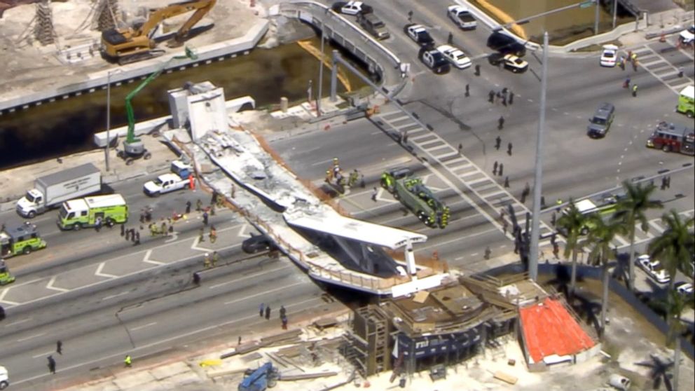 PHOTO: First responders were seen tending to injured victims on the scene of a pedestrian bridge that collapsed on the Florida International University campus. 