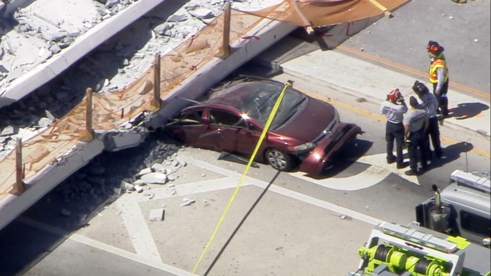 PHOTO: First responders were seen tending to injured victims on the scene of a pedestrian bridge that collapsed on the Florida International University campus.