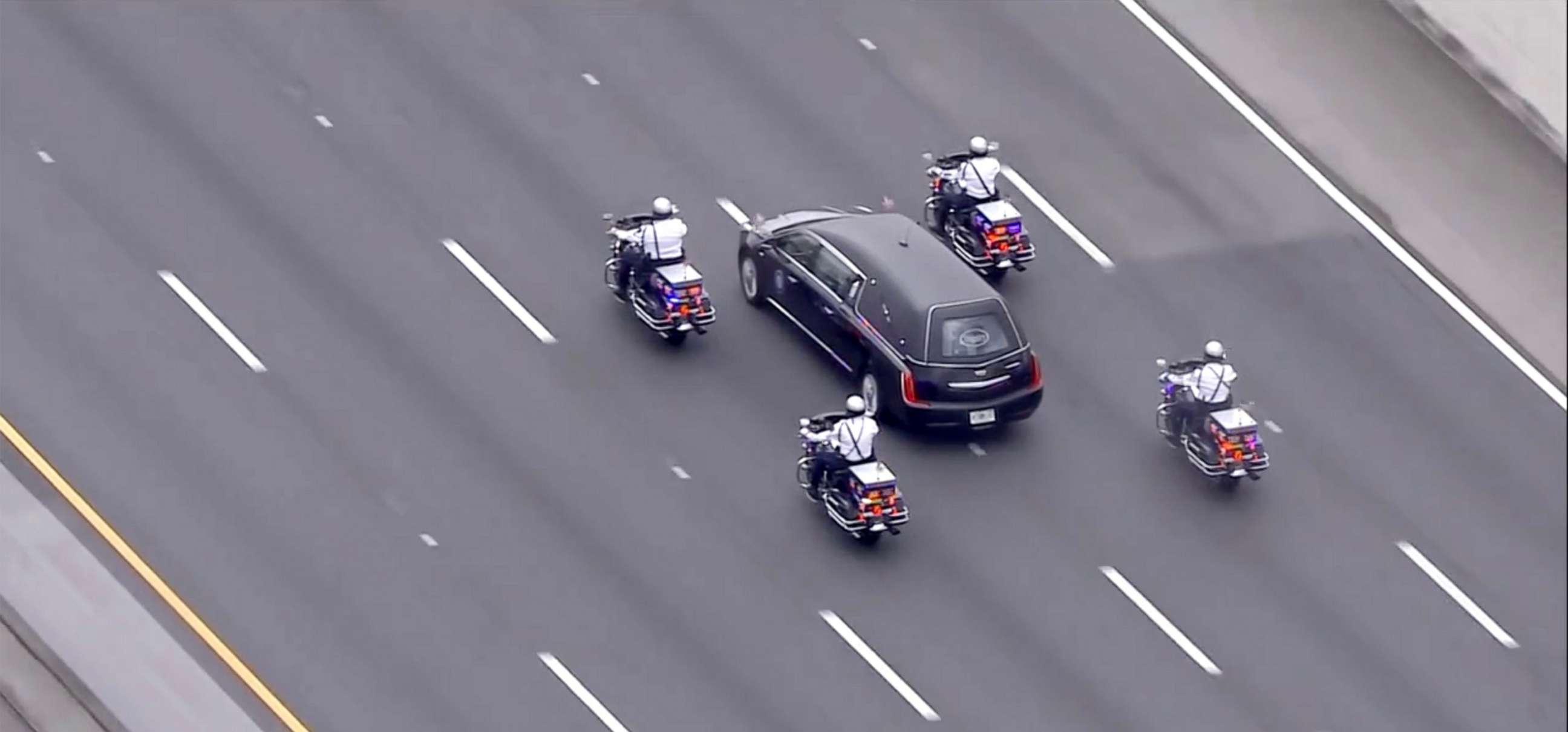 PHOTO: A procession escorts the remains of FBI Agent Laura Schwartzenberger to a memorial service in Miami Garderns, Fla., Feb. 6, 2021.